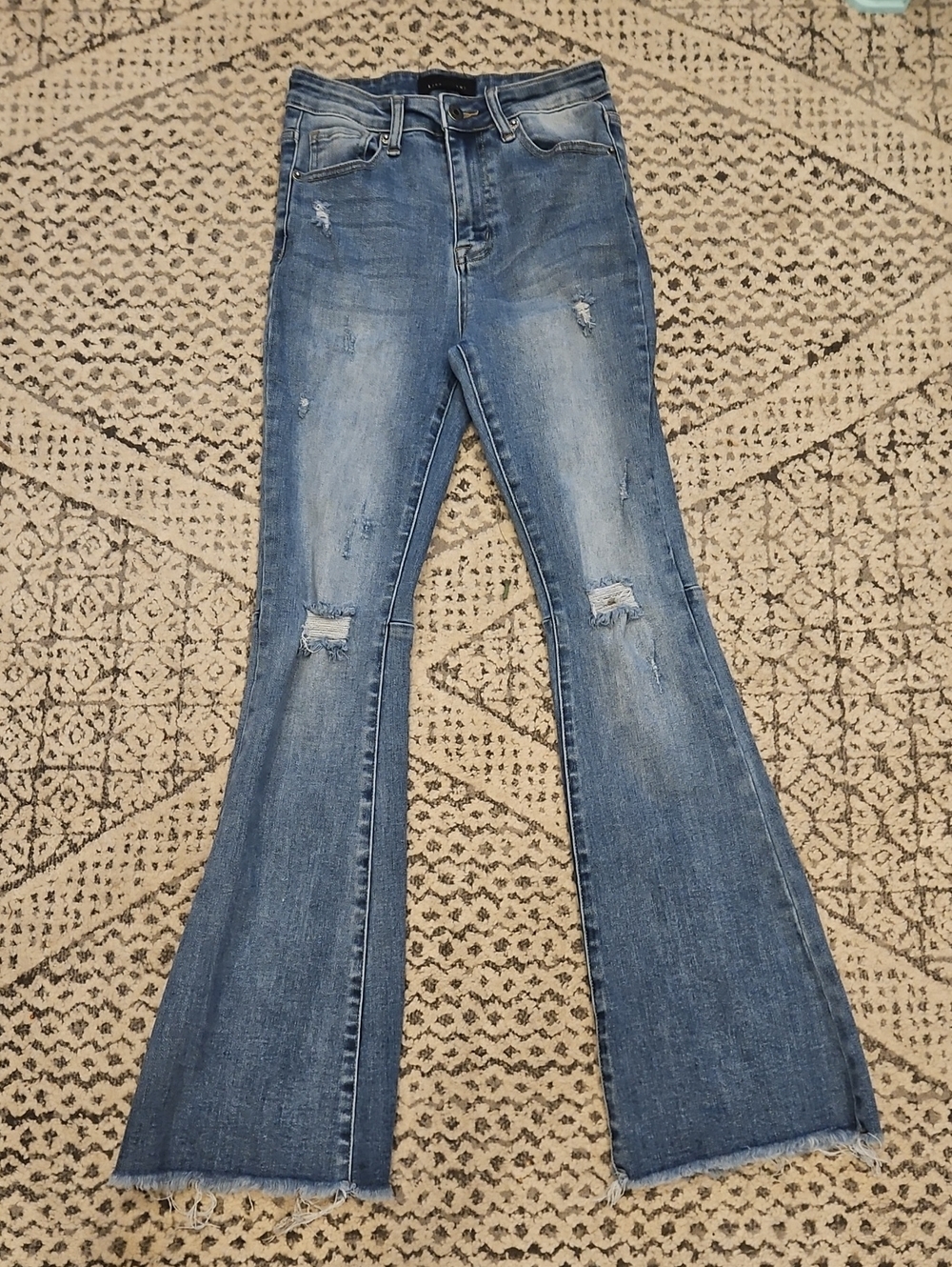 Risen High-Rise Distressed Flared Jeans - Blue